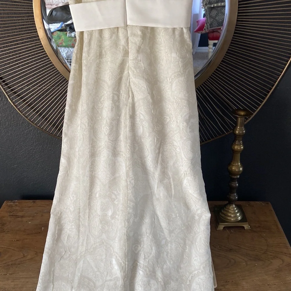Custom made ivory tone on tone sleeveless dress with satin ruffle and bow. - Picture 7 of 7